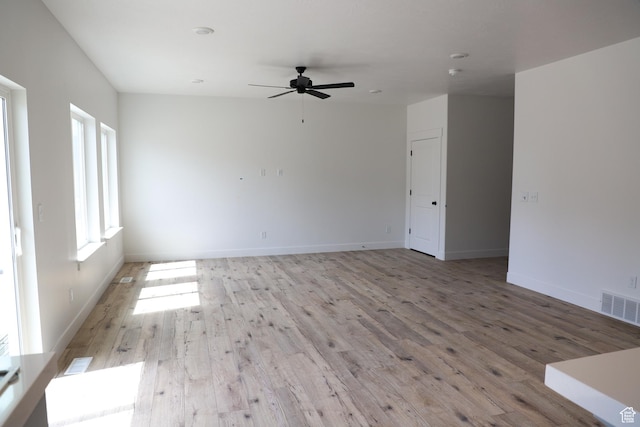 3711 N Janie St Unit 1015, Eagle Mountain, UT 84005 - unfurnished room with light wood finished floors, a ceiling fan, and baseboards