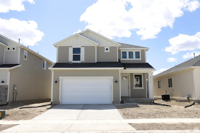 3711 N Janie St Unit 1015, Eagle Mountain, UT 84005 - view of front of house with driveway, board and batten siding, an attached garage, cooling unit, and covered porch