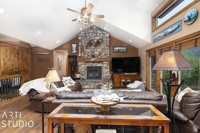 3575 N Foothill Ln, Eden, UT 84310 - living area with ceiling fan, a fireplace, healthy amount of natural light, wood finished floors, and lofted ceiling