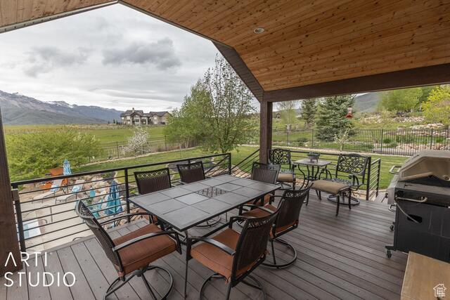 3575 N Foothill Ln, Eden, UT 84310 - wooden deck featuring outdoor dining space and a mountain view