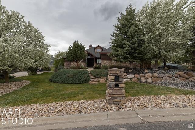 3575 N Foothill Ln, Eden, UT 84310 - view of property hidden behind natural elements featuring a front lawn