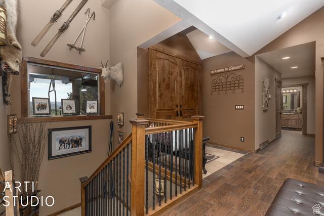 3575 N Foothill Ln, Eden, UT 84310 - corridor featuring an upstairs landing, lofted ceiling, light wood-type flooring, and baseboards