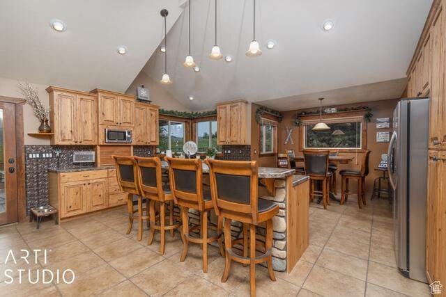 3575 N Foothill Ln, Eden, UT 84310 - kitchen with appliances with stainless steel finishes, light tile patterned floors, backsplash, lofted ceiling, and recessed lighting