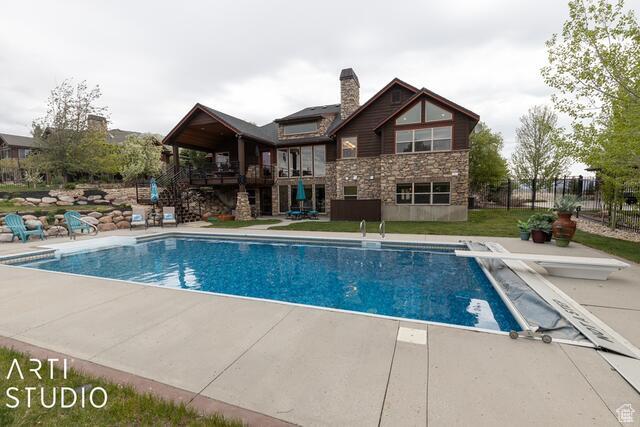 3575 N Foothill Ln, Eden, UT 84310 - swimming pool featuring a diving board, a patio, and stairs