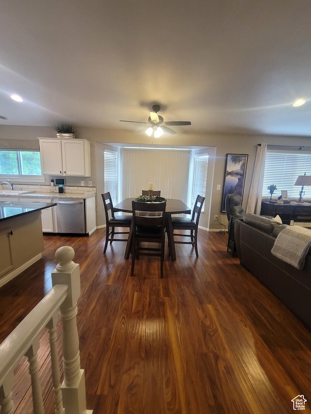 2981 S Pika Dr, West Valley City, UT 84128 - dining space with dark wood-style floors, a ceiling fan, and baseboards