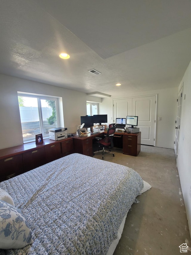 2981 S Pika Dr, West Valley City, UT 84128 - bedroom featuring concrete flooring, a desk, and recessed lighting