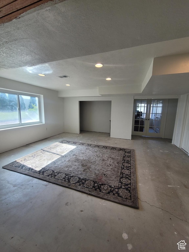 2981 S Pika Dr, West Valley City, UT 84128 - unfurnished room with concrete flooring, a textured ceiling, and recessed lighting