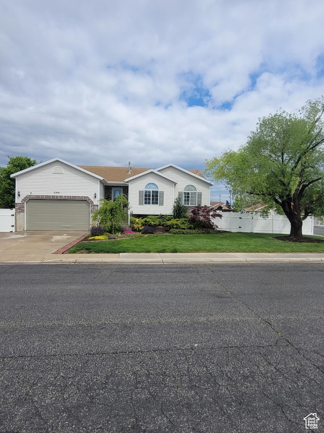 2981 S Pika Dr, West Valley City, UT 84128 - ranch-style home featuring an attached garage and driveway