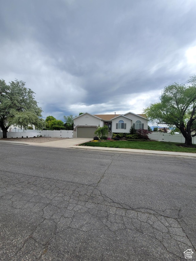 2981 S Pika Dr, West Valley City, UT 84128 - view of front of property with driveway and a garage