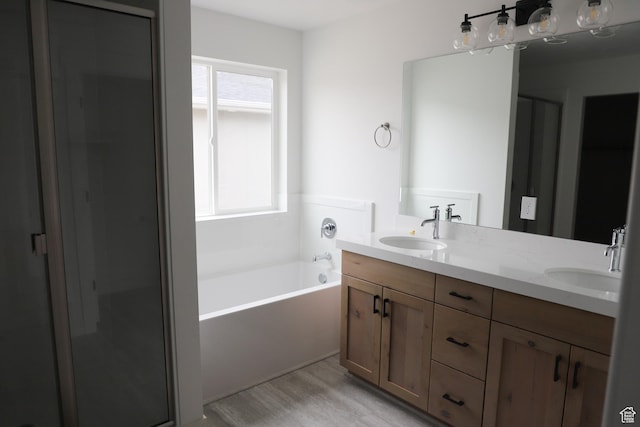 3736 N Janie St Unit 1005, Eagle Mountain, UT 84005 - full bath featuring double vanity, a garden tub, wood finished floors, and a stall shower