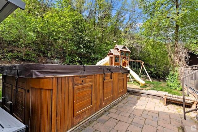 5548 E Emigration Canyon Rd E, Salt Lake City, UT 84108 - view of patio featuring a hot tub and a playground