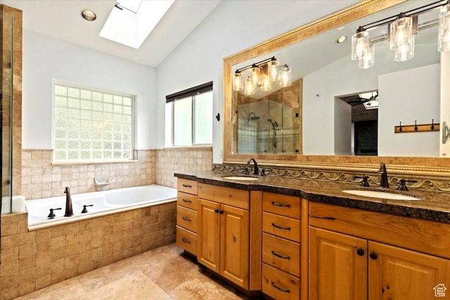 5548 E Emigration Canyon Rd E, Salt Lake City, UT 84108 - bathroom with a skylight, lofted ceiling, a shower stall, double vanity, and a garden tub