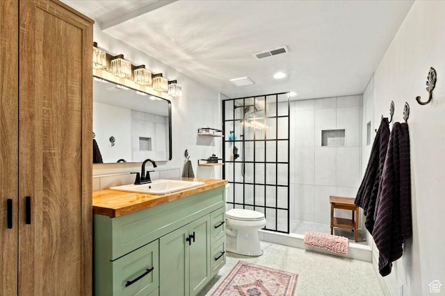 5548 E Emigration Canyon Rd E, Salt Lake City, UT 84108 - full bath with vanity, toilet, tiled shower, and speckled floor