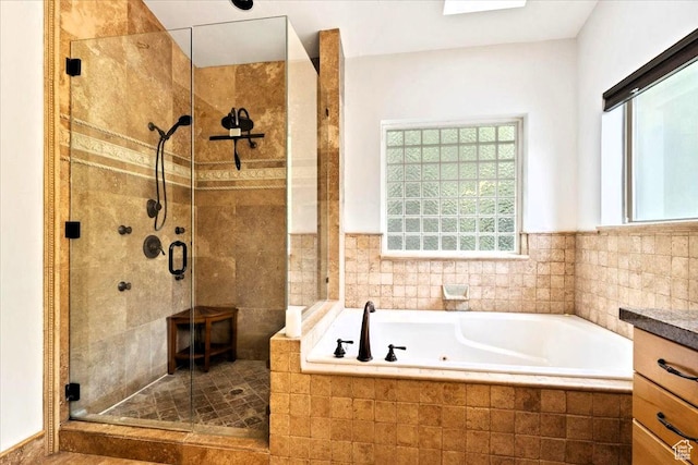 5548 E Emigration Canyon Rd E, Salt Lake City, UT 84108 - bathroom featuring plenty of natural light, a tub with jets, and a stall shower