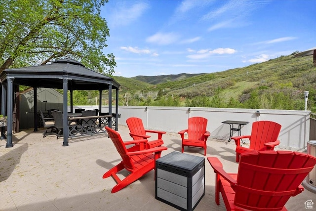 5548 E Emigration Canyon Rd E, Salt Lake City, UT 84108 - view of patio / terrace featuring a mountain view, a gazebo, an outdoor fire pit, and outdoor dining area