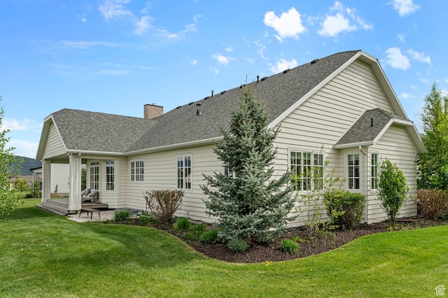 567 W Cascade Meadows Loop S, Midway, UT 84049 - back of property with a patio, a lawn, a shingled roof, and a chimney