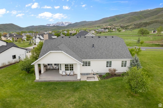 567 W Cascade Meadows Loop S, Midway, UT 84049 - back of house with a mountain view, a patio, a lawn, and a shingled roof