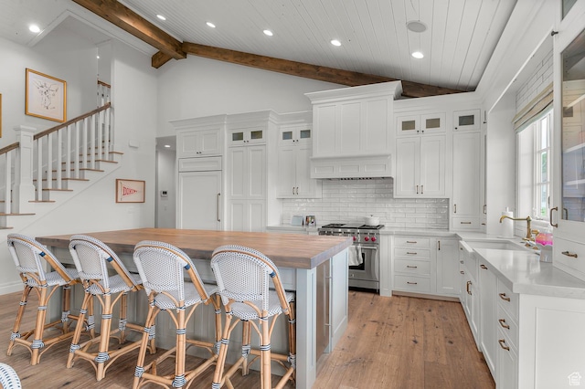 567 W Cascade Meadows Loop S, Midway, UT 84049 - kitchen featuring high end stainless steel range, a sink, light wood finished floors, wooden counters, and tasteful backsplash