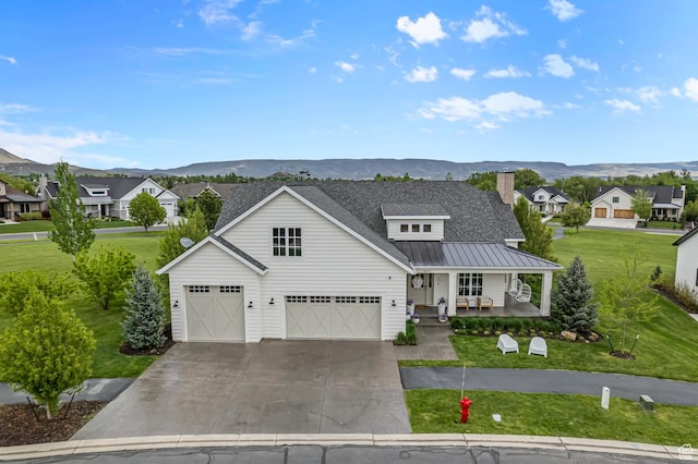 567 W Cascade Meadows Loop S, Midway, UT 84049 - modern farmhouse style home featuring covered porch, a mountain view, a front lawn, and a standing seam roof