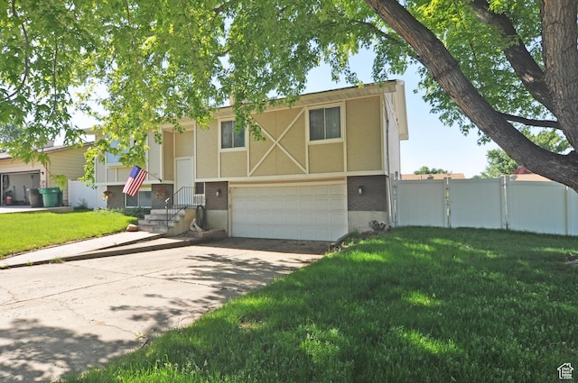 1185 W 725 N, Clearfield, UT 84015 - view of front of home featuring a garage, driveway, brick siding, a gate, and stucco siding