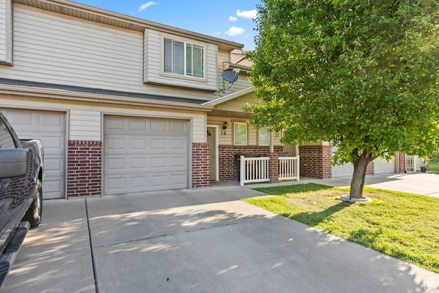 2856 W 3965 S Unit 78, West Haven, UT 84401 - view of property with brick siding, concrete driveway, a porch, and an attached garage