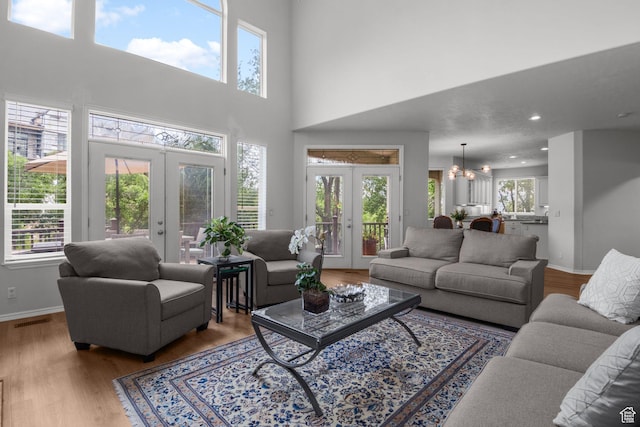 2016 E Graystone Ln S, Draper, UT 84020 - living area with french doors, wood finished floors, a chandelier, baseboards, and recessed lighting