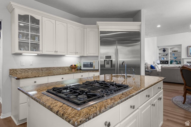 2016 E Graystone Ln S, Draper, UT 84020 - kitchen featuring stovetop with downdraft, a sink, white microwave, built in refrigerator, and wood finished floors