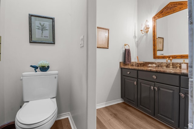 2016 E Graystone Ln S, Draper, UT 84020 - bathroom featuring wood finished floors, vanity, toilet, and baseboards