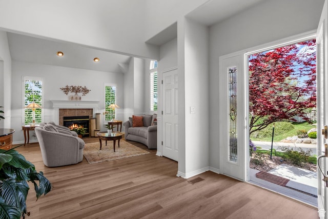 2016 E Graystone Ln S, Draper, UT 84020 - foyer entrance featuring light wood-type flooring, a tiled fireplace, baseboards, and recessed lighting