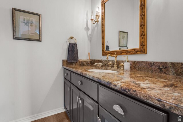 2016 E Graystone Ln S, Draper, UT 84020 - bathroom featuring vanity, baseboards, and wood finished floors