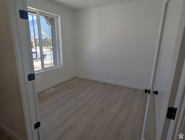 737 N Plainsman Dr Unit 108, Spanish Fork, UT 84660 - unfurnished room with light wood-style flooring and baseboards