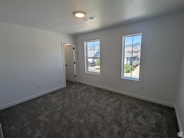 737 N Plainsman Dr Unit 108, Spanish Fork, UT 84660 - unfurnished room featuring dark colored carpet and baseboards