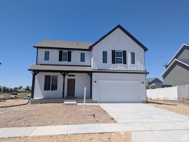 737 N Plainsman Dr Unit 108, Spanish Fork, UT 84660 - view of front facade with a porch, board and batten siding, an attached garage, and concrete driveway
