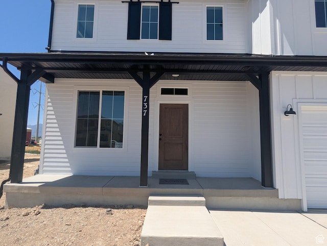 737 N Plainsman Dr Unit 108, Spanish Fork, UT 84660 - doorway to property with a porch and board and batten siding
