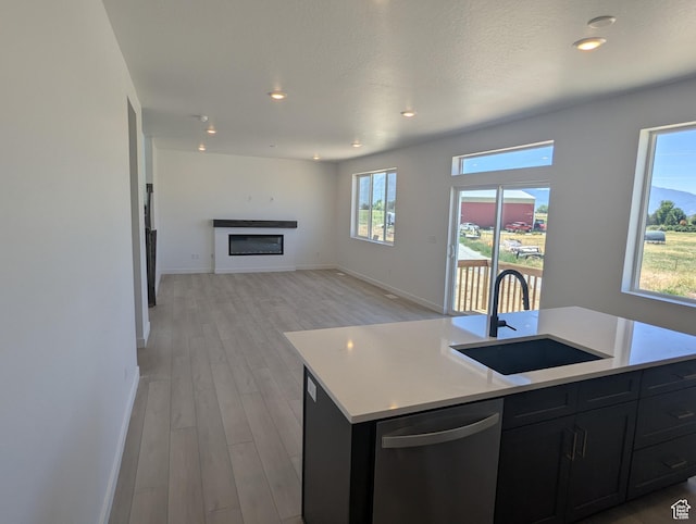 737 N Plainsman Dr Unit 108, Spanish Fork, UT 84660 - kitchen with dishwasher, dark cabinetry, light wood finished floors, light countertops, and recessed lighting