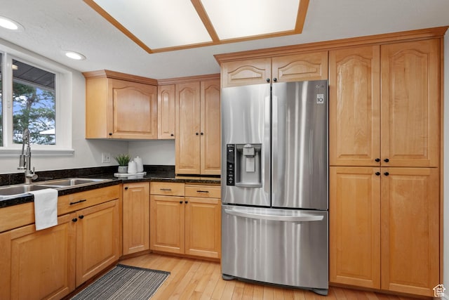 2592 S 50 W, Bountiful, UT 84010 - kitchen featuring stainless steel refrigerator with ice dispenser, a sink, light wood finished floors, recessed lighting, and dark stone countertops