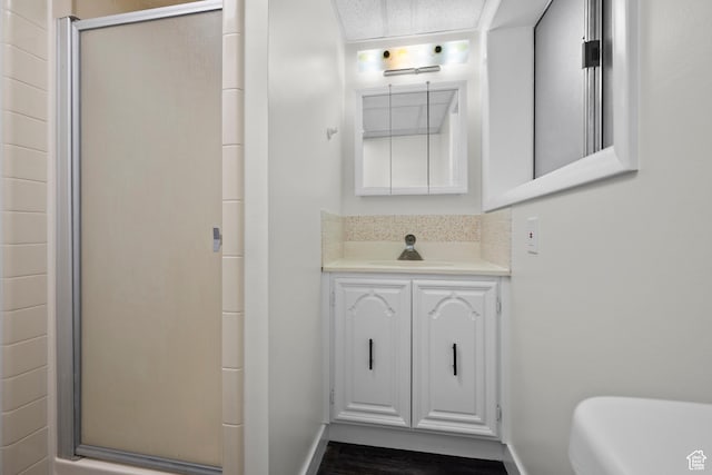 2592 S 50 W, Bountiful, UT 84010 - full bath featuring a shower stall, baseboards, vanity, and wood finished floors
