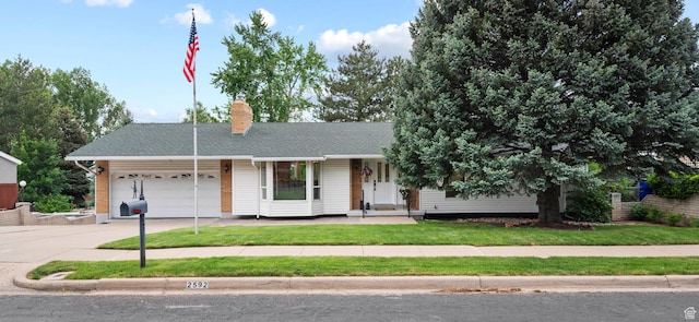 2592 S 50 W, Bountiful, UT 84010 - ranch-style house featuring driveway, a garage, a chimney, and a front yard
