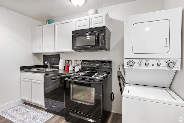 1900 N 1400 E, Provo, UT 84604 - kitchen featuring black appliances, stacked washer and clothes dryer, a sink, wood finished floors, and white cabinetry