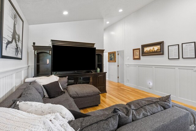 1900 N 1400 E, Provo, UT 84604 - living area featuring wood finished floors, a decorative wall, a wainscoted wall, and recessed lighting