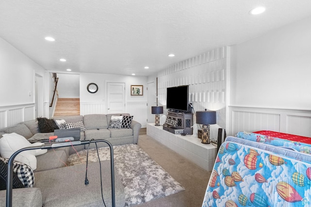 1900 N 1400 E, Provo, UT 84604 - living room featuring carpet flooring, recessed lighting, wainscoting, stairs, and a decorative wall