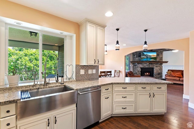 2149 E 3325 N, Layton, UT 84040 - kitchen with dishwasher, a peninsula, a stone fireplace, dark wood-type flooring, and light stone counters