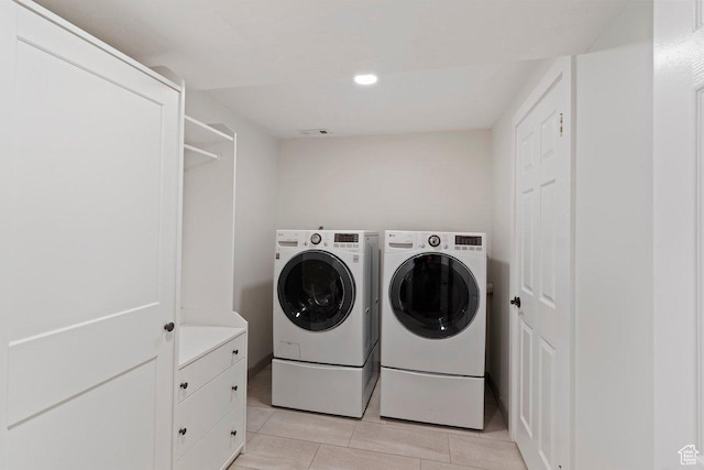 2149 E 3325 N, Layton, UT 84040 - laundry area featuring separate washer and dryer, light tile patterned floors, and recessed lighting