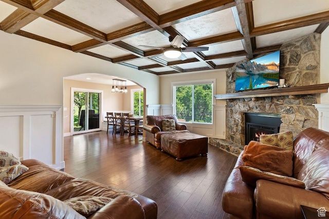 2149 E 3325 N, Layton, UT 84040 - living room with coffered ceiling, ceiling fan, a fireplace, arched walkways, and dark wood finished floors