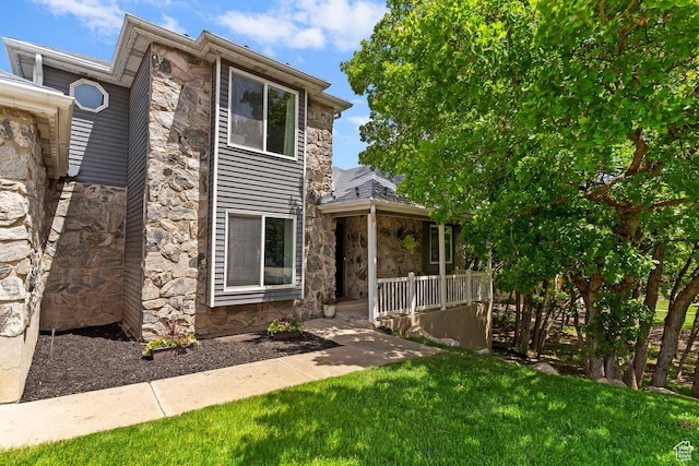 2149 E 3325 N, Layton, UT 84040 - view of front of house featuring stone siding and a front lawn