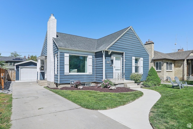 2672 S Filmore St, Salt Lake City, UT 84106 - bungalow-style house featuring driveway, an outdoor structure, a chimney, a detached garage, and a shingled roof