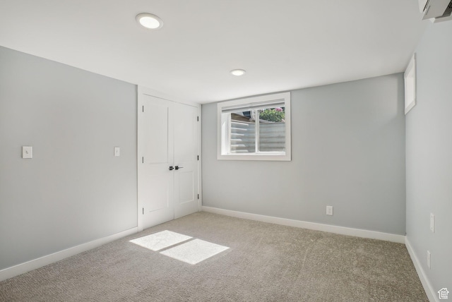 2672 S Filmore St, Salt Lake City, UT 84106 - unfurnished bedroom with carpet flooring, recessed lighting, baseboards, and a wall unit AC