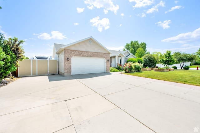 7215 S Aerie Hill Dr W, West Jordan, UT 84081 - single story home with concrete driveway, brick siding, and a garage