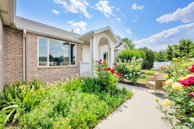 7215 S Aerie Hill Dr W, West Jordan, UT 84081 - entrance to property with brick siding and a shingled roof