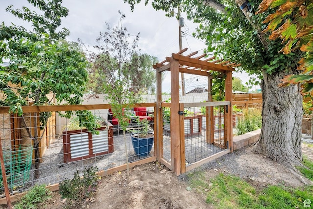 2553 W Evening Dove Cir S, West Valley City, UT 84119 - gate with a vegetable garden and a fenced backyard